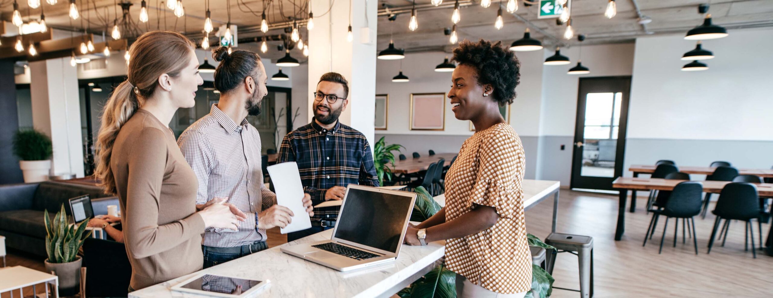 Group of business people gathered around a table.