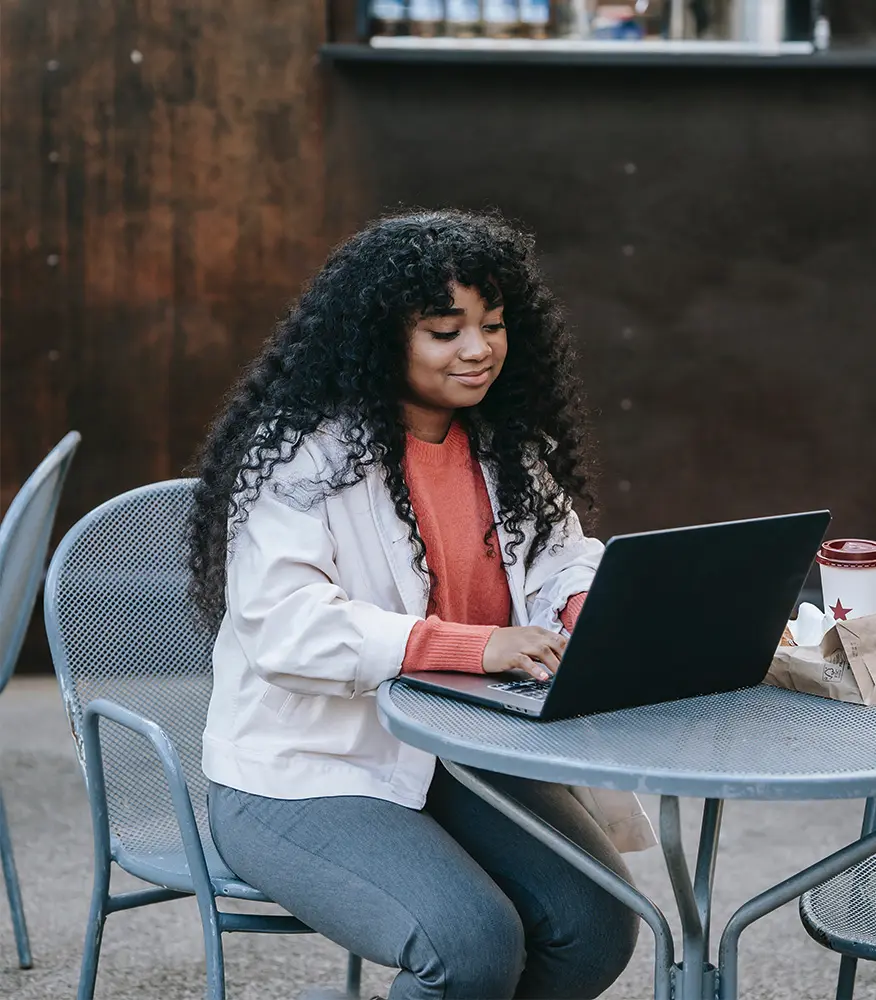 A young woman working at a computer